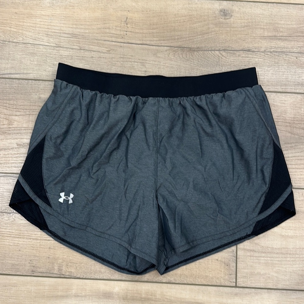 Under Armour size medium women’s heathered gray and black shorts